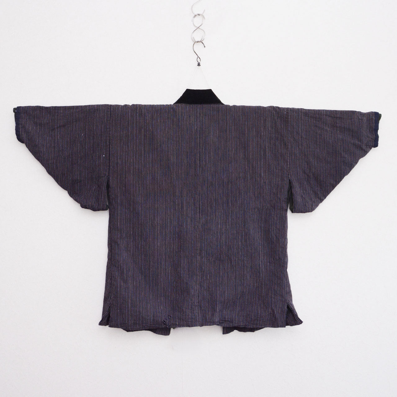 Vintage Japanese noragi jacket on kimono hanger, vertical stripe cotton with black velvet collar, back view, early Showa era