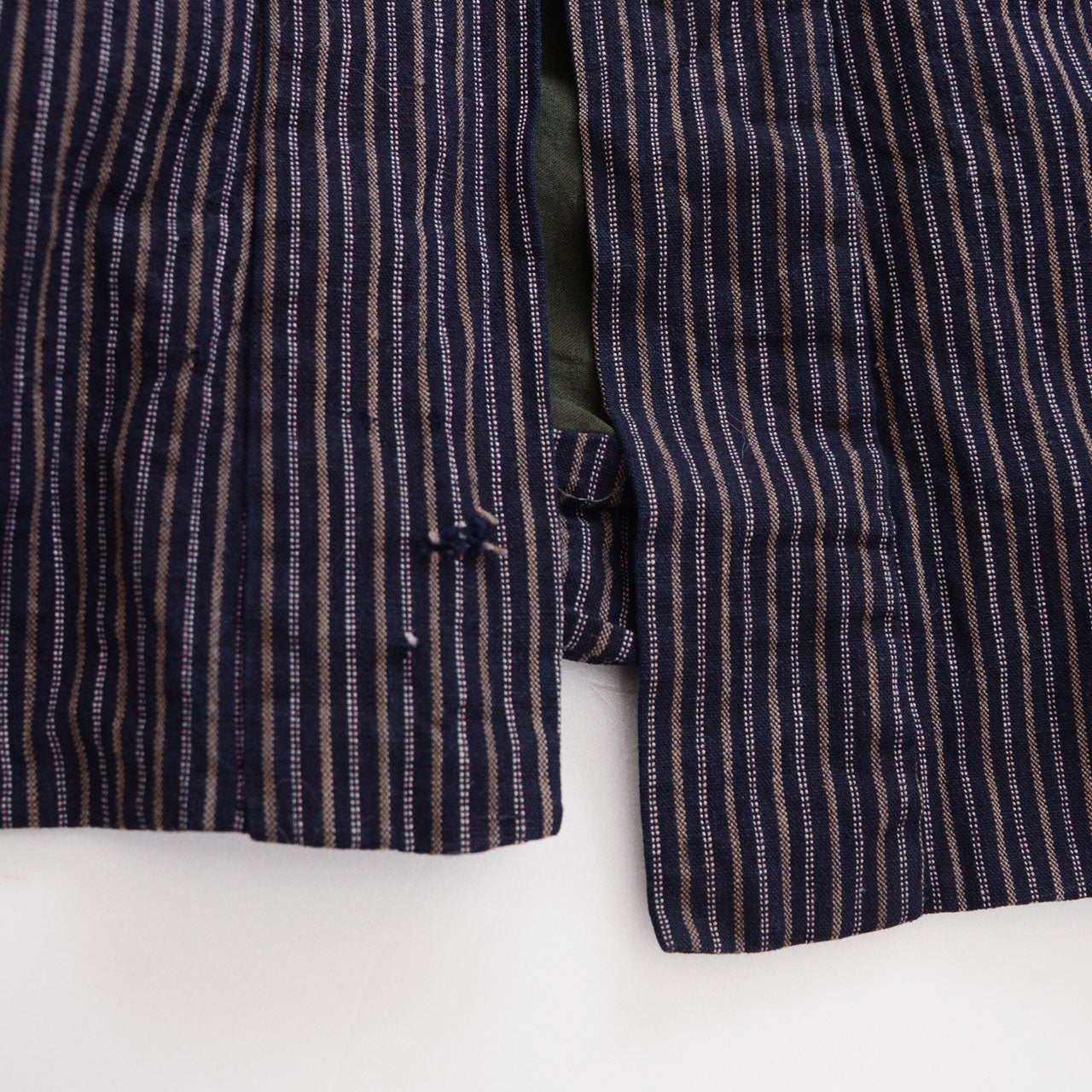 Lower front collar detail of vintage Japanese noragi jacket, black velvet collar on vertical stripe cotton, early Showa era