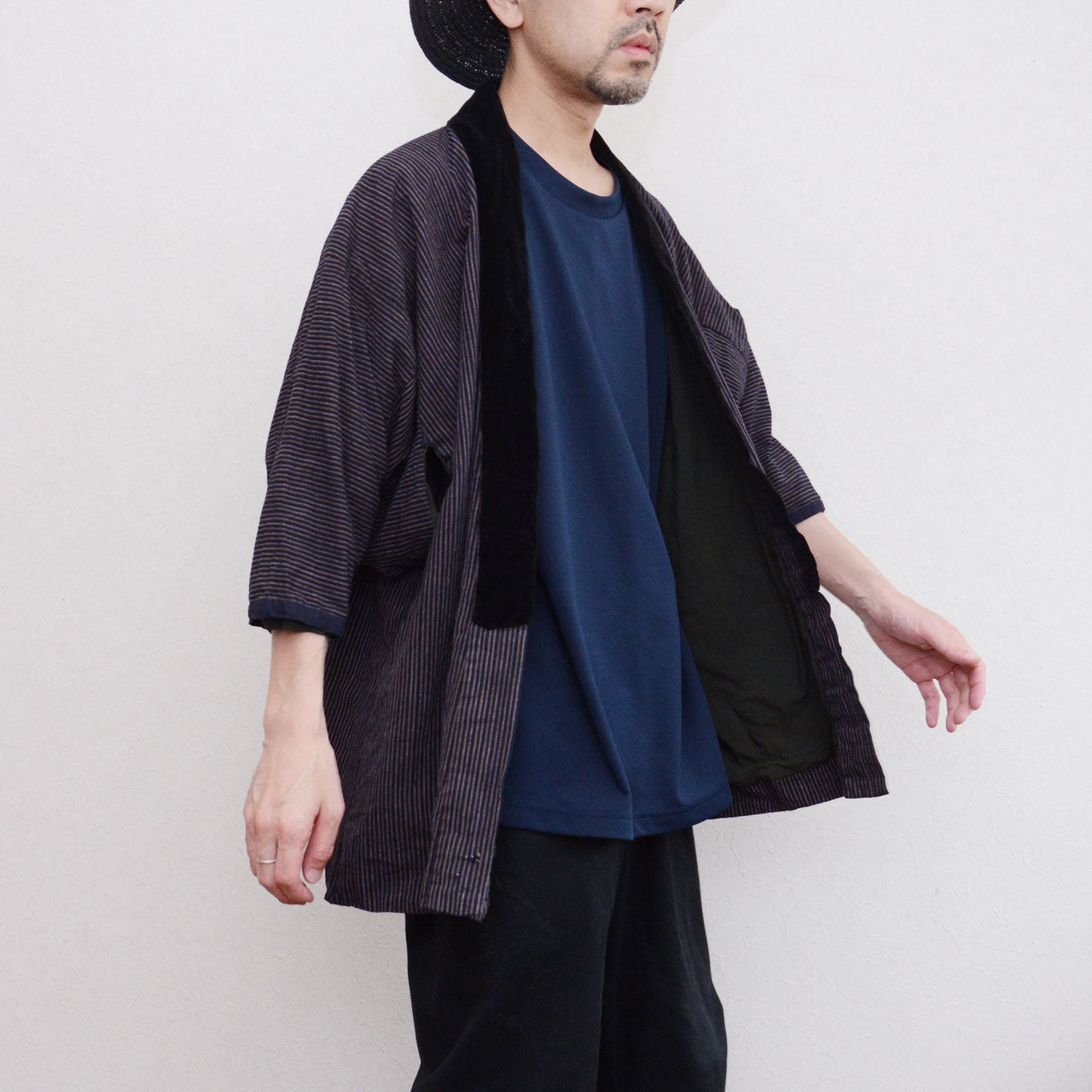 Vintage Japanese noragi jacket worn, vertical stripe cotton with black velvet collar, front side view, early Showa era