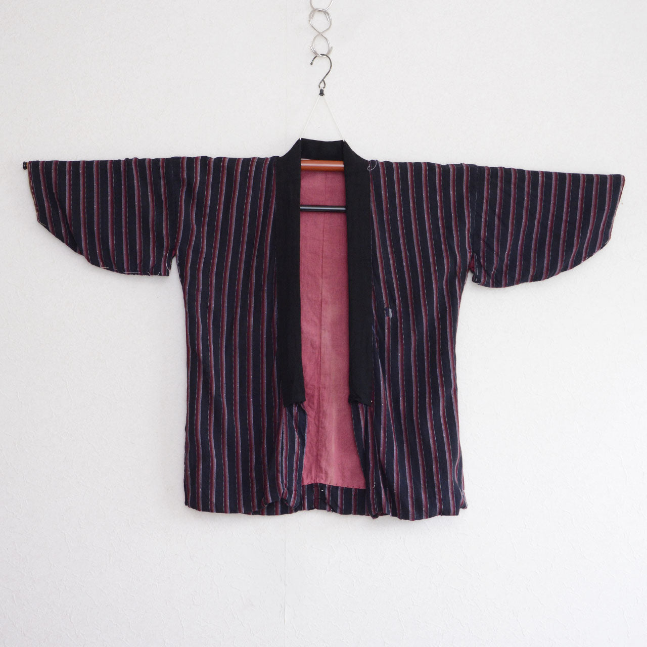 Japanese vintage striped noragi with black front edging and a salmon-pink lining
