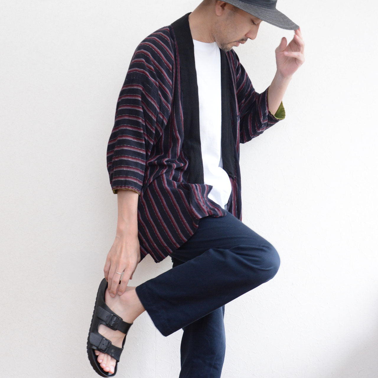 Japanese vintage striped noragi worn with a white T-shirt, dark trousers, and a black hat