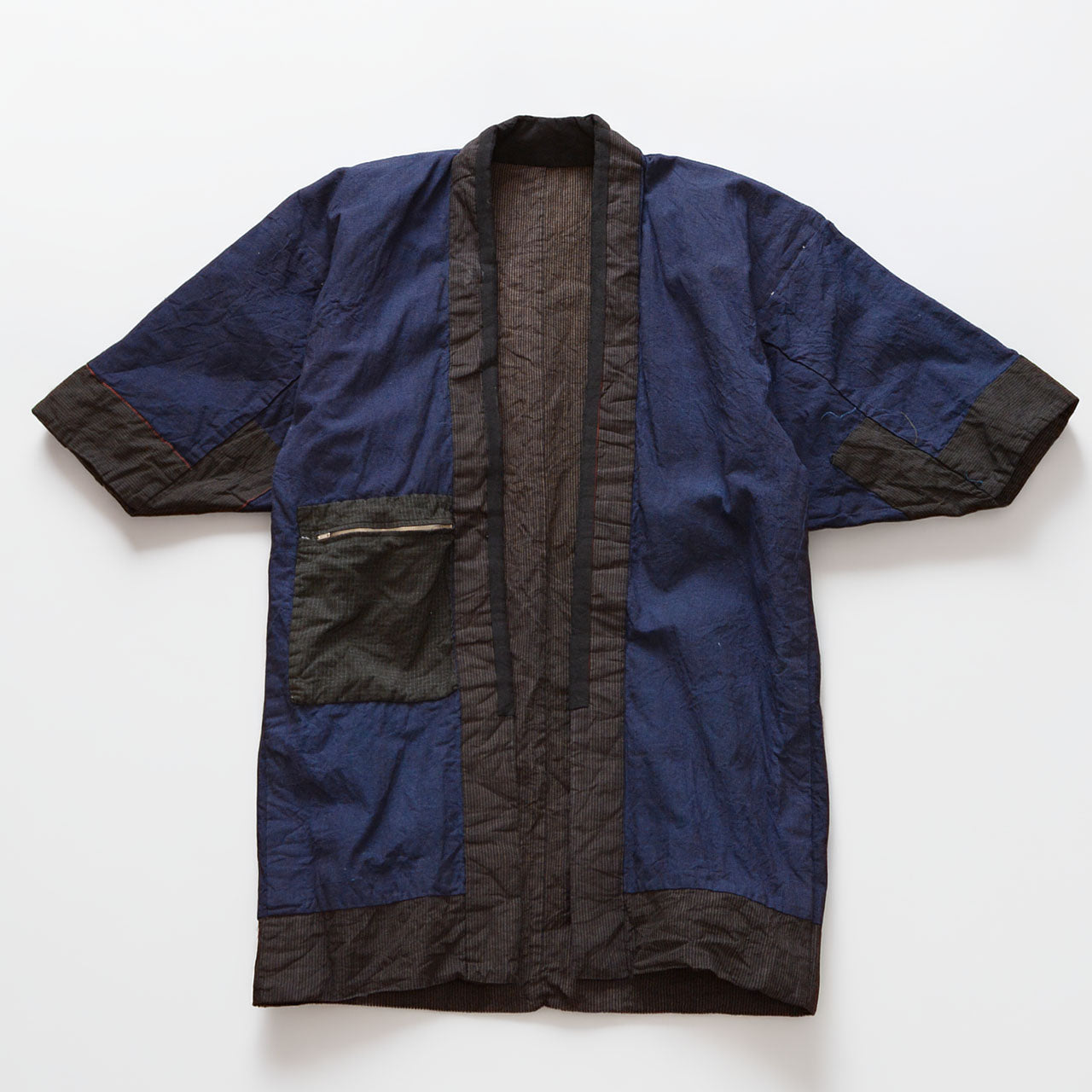 Vintage Japanese noragi work jacket, striped cotton exterior with indigo plain lining, mid-Showa era Tohoku — reverse side, laid flat