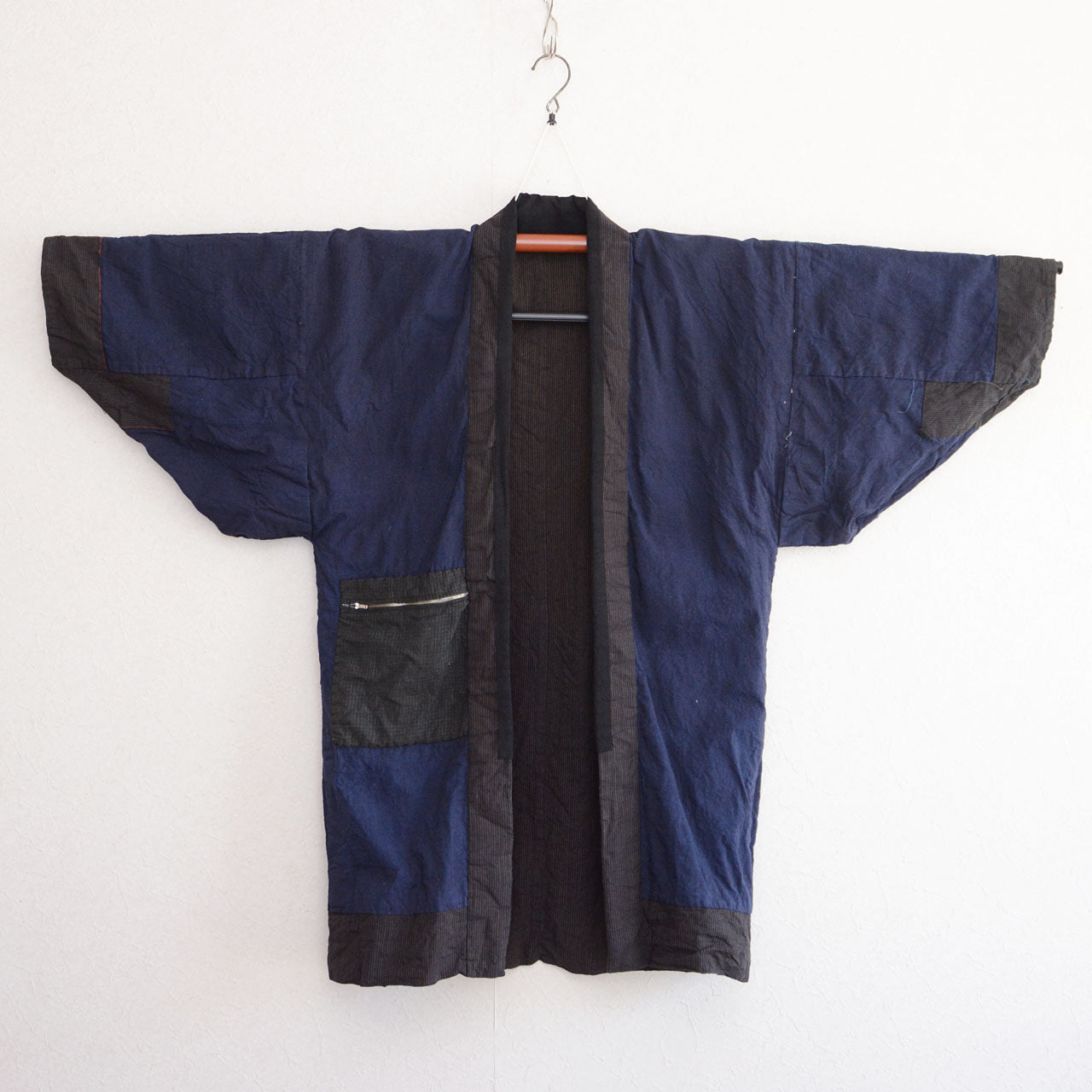 Vintage Japanese noragi work jacket, indigo plain lining interior, mid-Showa era Tohoku — front view, kimono hanger
