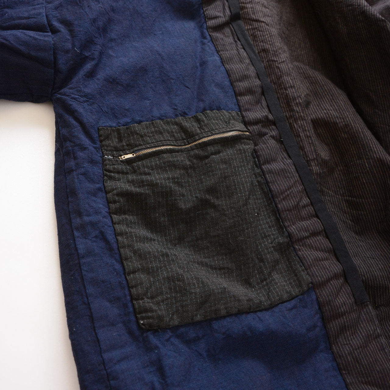 Vintage Japanese noragi work jacket, inner pocket interior detail with YKK zipper, mid-Showa era Tohoku