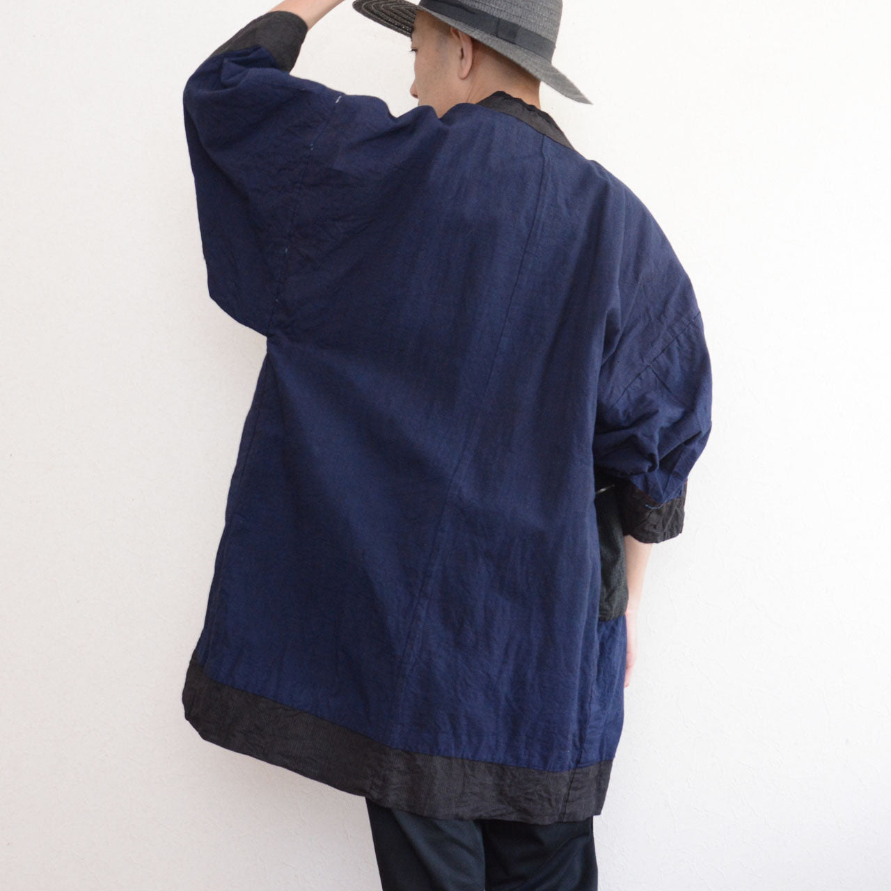 Vintage Japanese noragi work jacket styled with white tee, dynamic back view on model, mid-Showa era Japan vintage