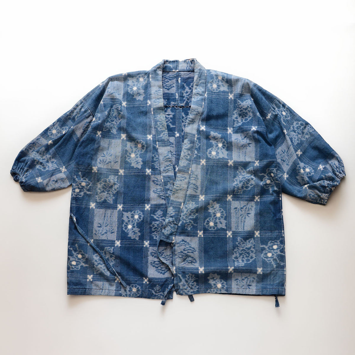 1950s–1960s Japanese vintage uwappari noragi jacket in indigo-dyed cotton with a grid pattern and floral and botanical motifs