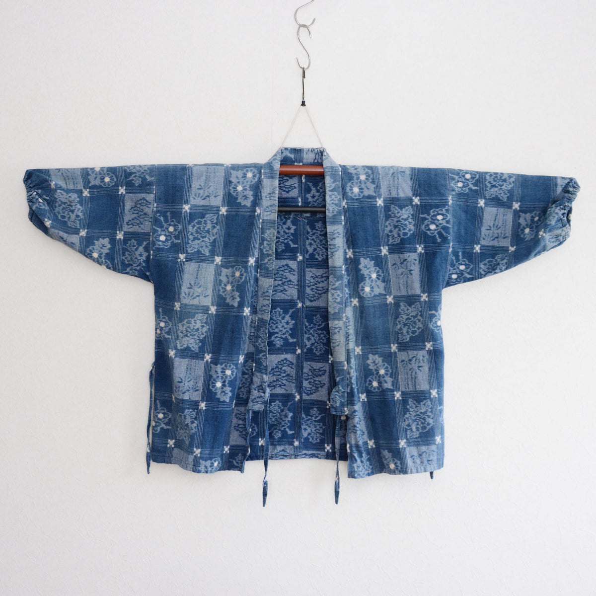 Indigo cotton uwappari noragi jacket with floral and botanical grid motifs, fabric ties and elasticated cuffs
