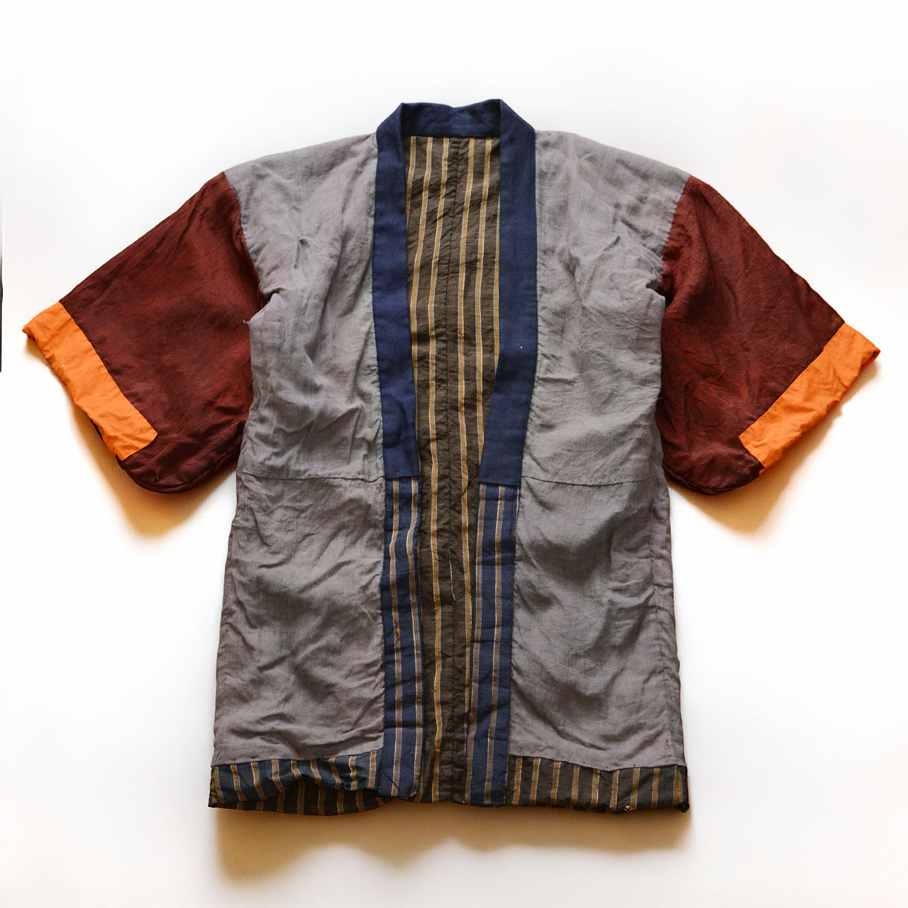 Vintage Japanese noragi jacket, Showa era, mixed fabric, gray body with burgundy and orange patchwork sleeves, front view