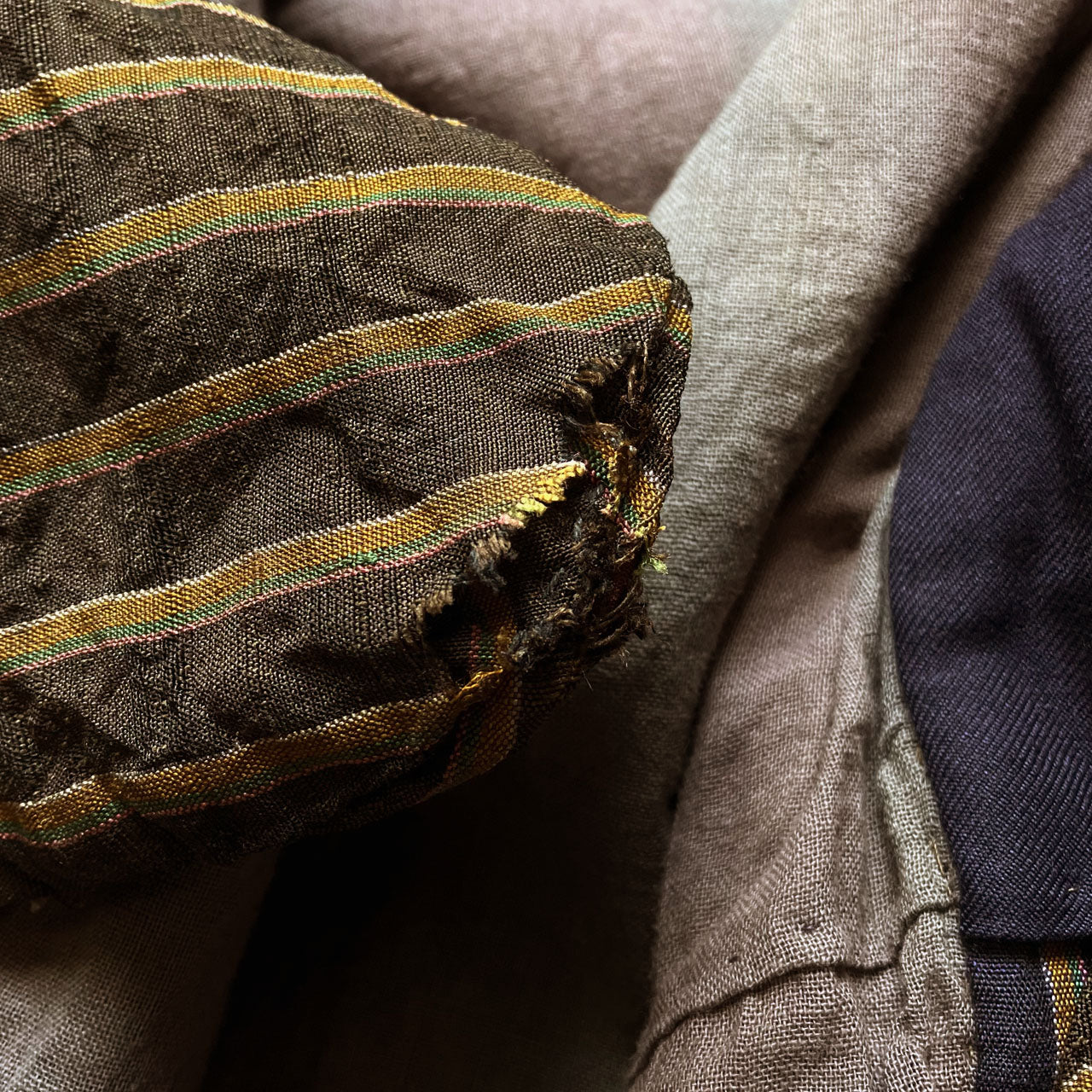 Vintage Japanese noragi jacket, Showa era, multicolor stripe fabric with fraying damage at seam area, condition detail