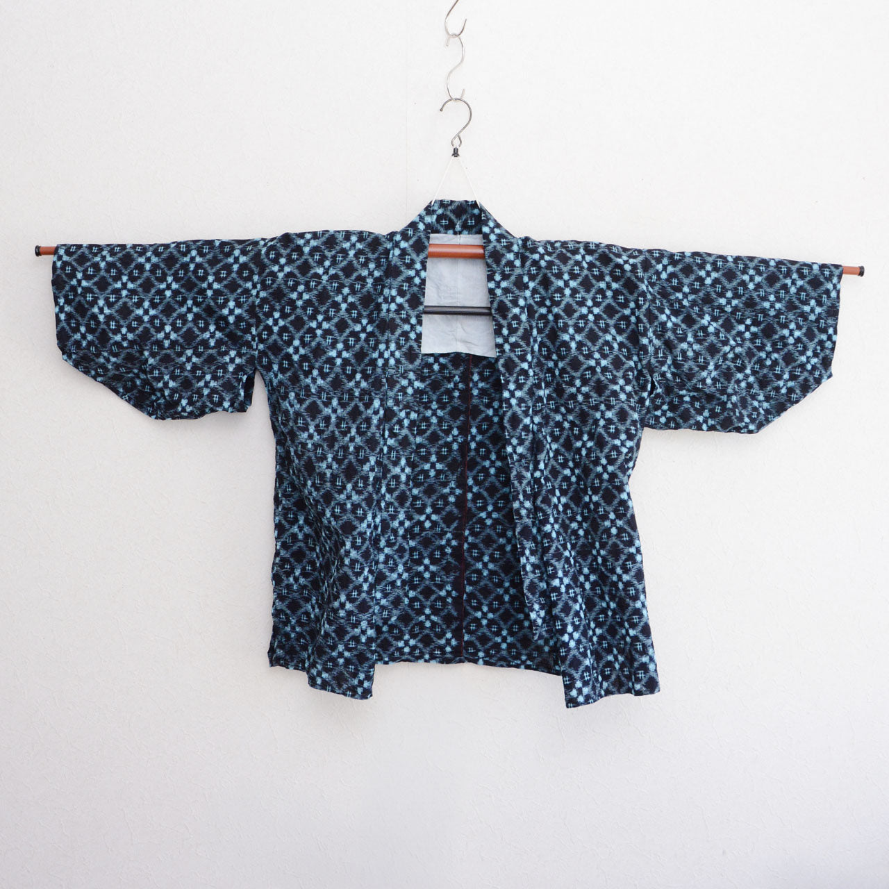 Vintage Japanese work jacket in hand-sewn indigo cotton with irregular geometric kasuri weave