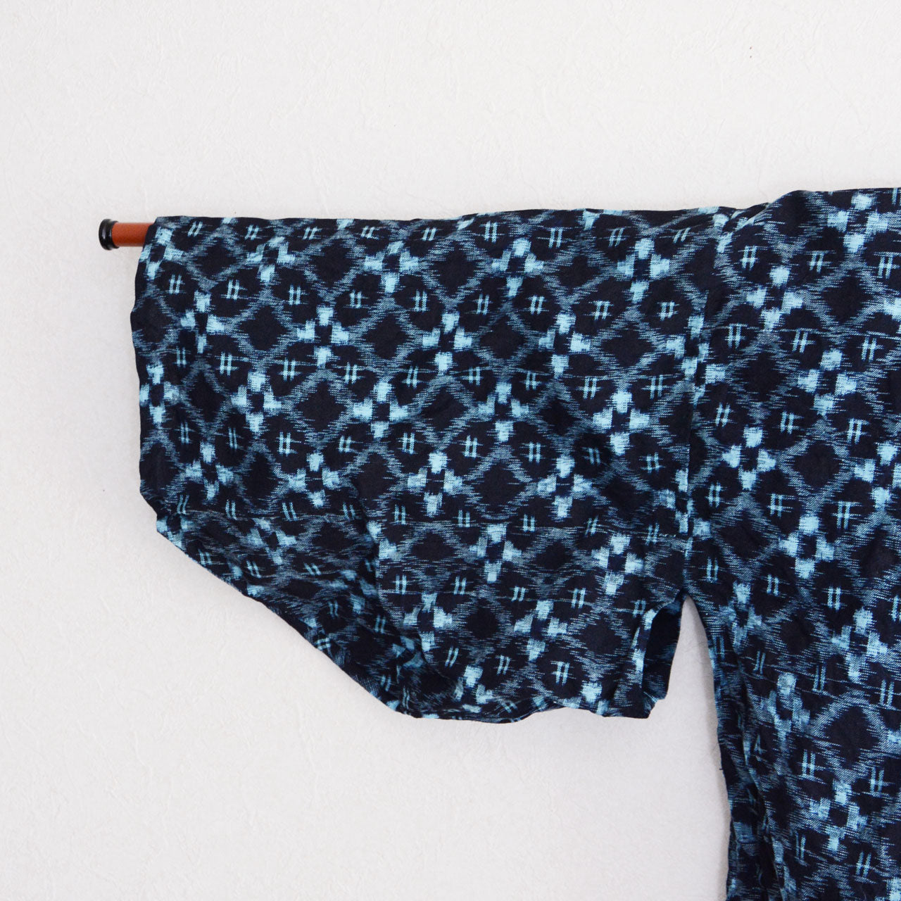 Hand-sewn Japanese rural work jacket in aged indigo cotton with repeating kasuri motif