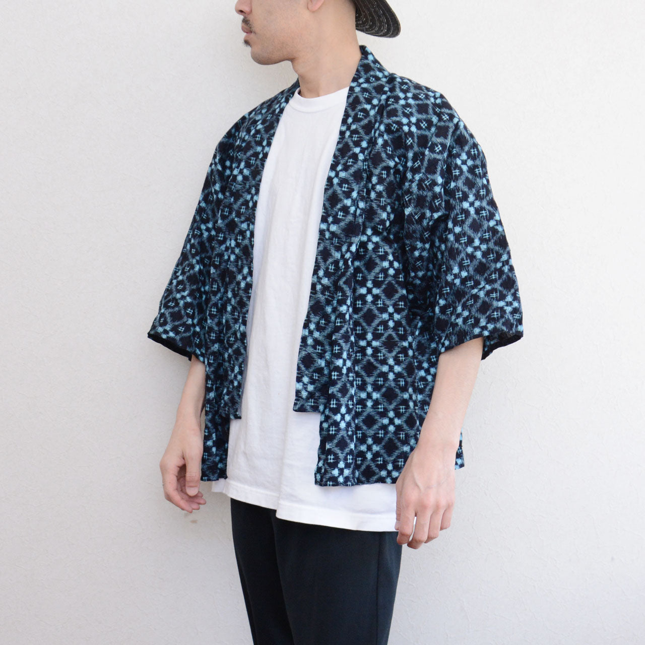 Slow fashion Japanese work jacket in hand-sewn indigo cotton with traditional ikat weave