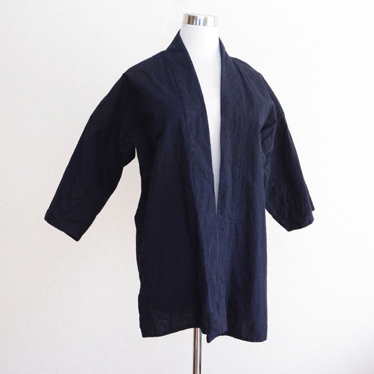 A vintage Japanese noragi made from plain indigo-dyed cotton fabric.