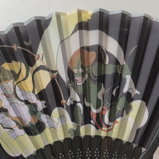 Close-up video of traditional bamboo ribs and printed polyester surface of Japanese fan