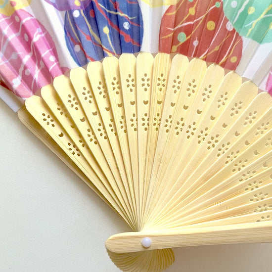 Compact Mizufuusen folding fan shown from different angles