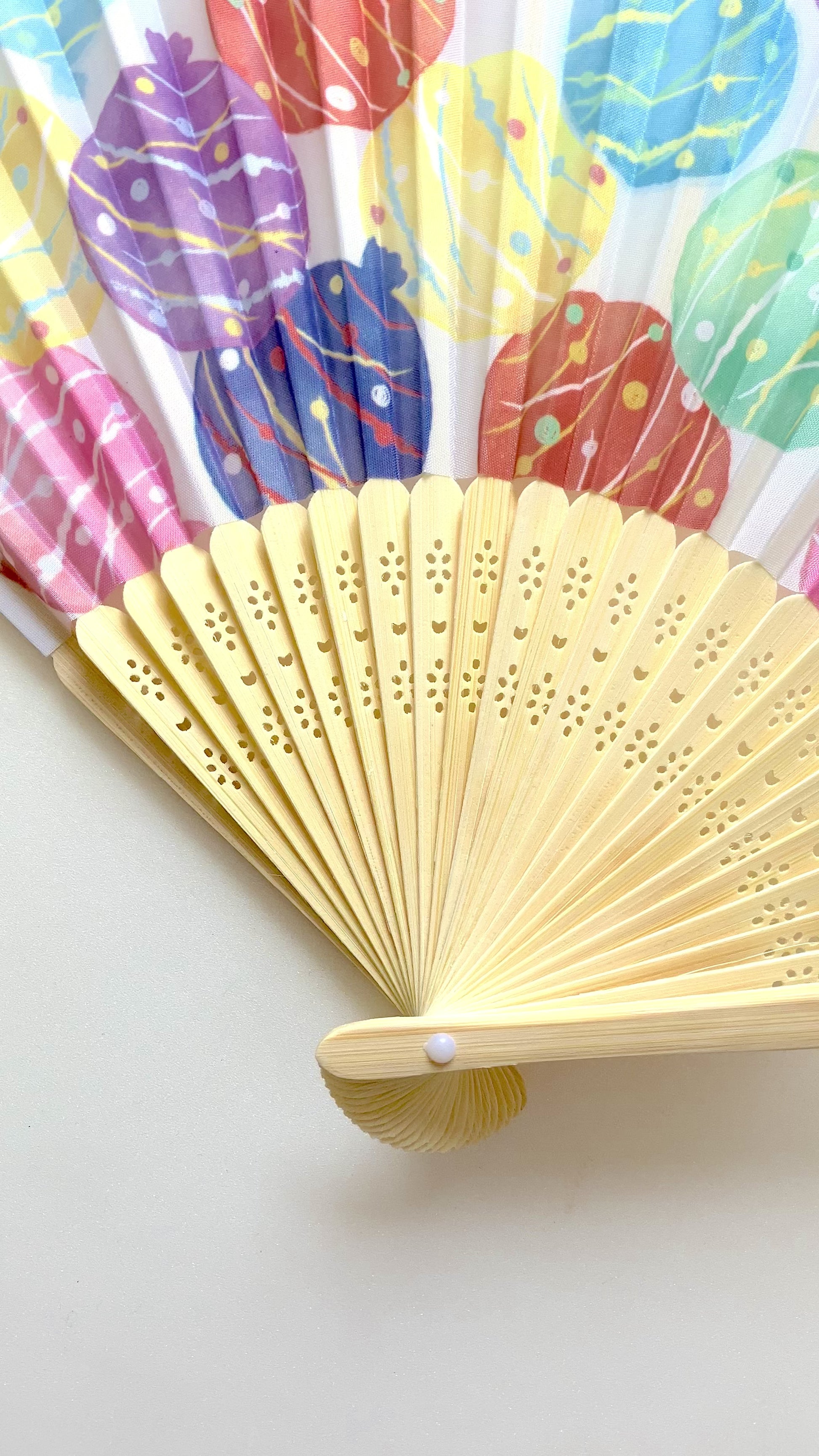 Compact Mizufuusen folding fan shown from different angles