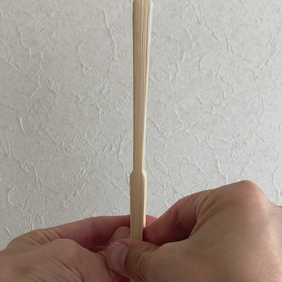 Unfolding folding fan with water balloon design