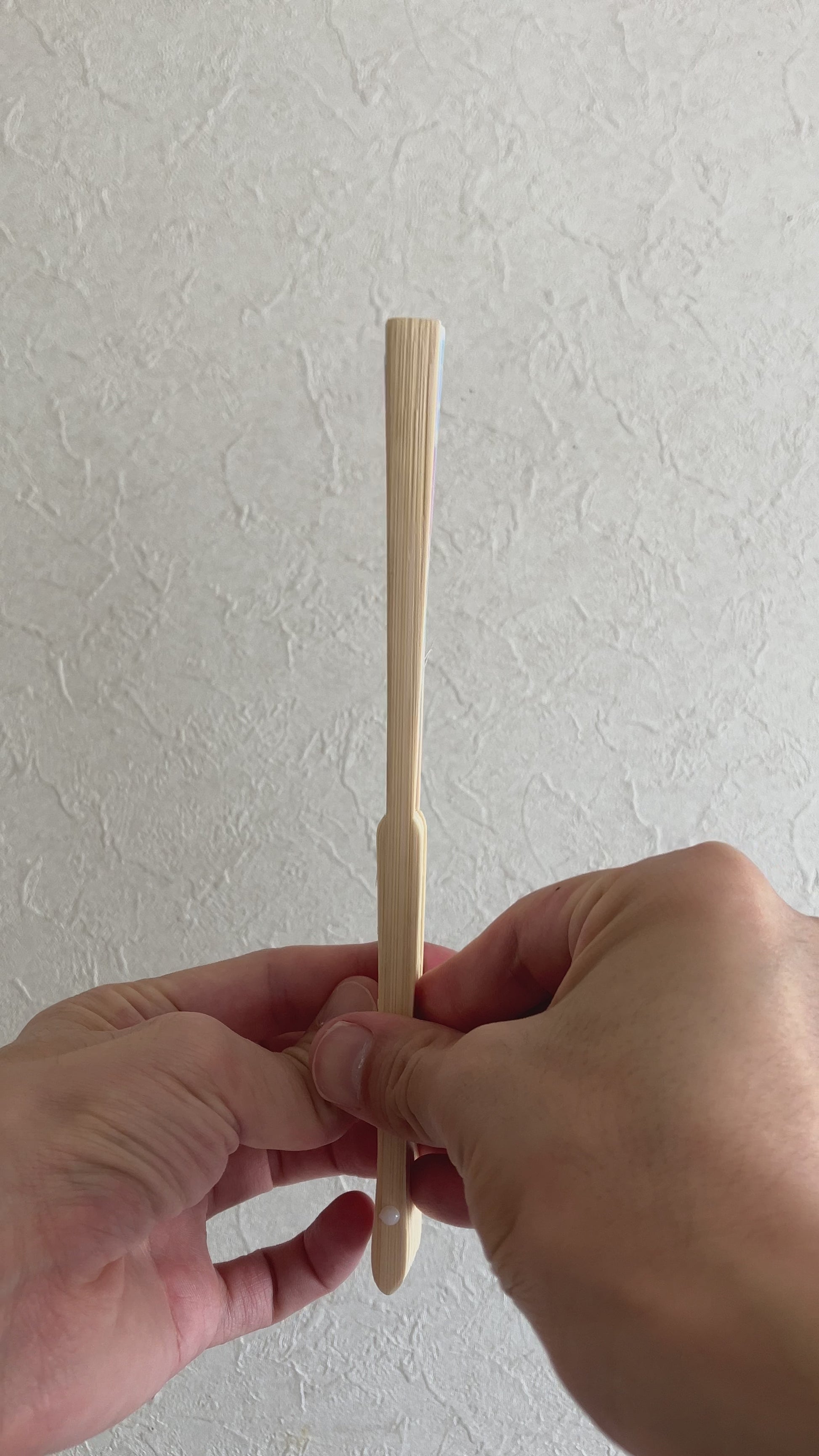 Unfolding folding fan with water balloon design