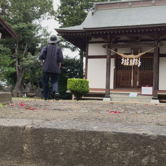 Japanese vintage noragi worn and in motion, navy blue stripe cotton, hand-stitched Showa era workwear from Tohoku