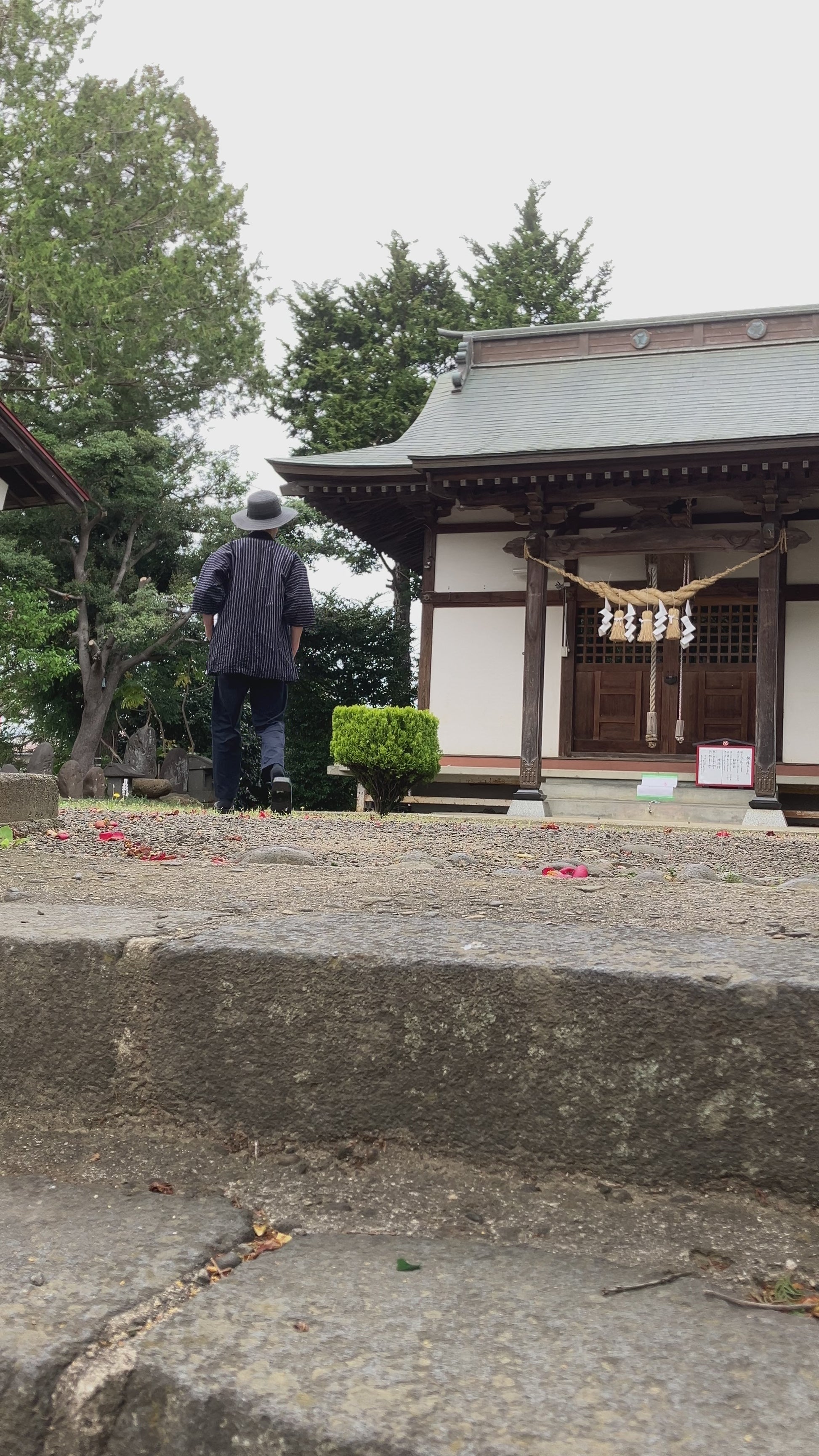Japanese vintage noragi worn and in motion, navy blue stripe cotton, hand-stitched Showa era workwear from Tohoku
