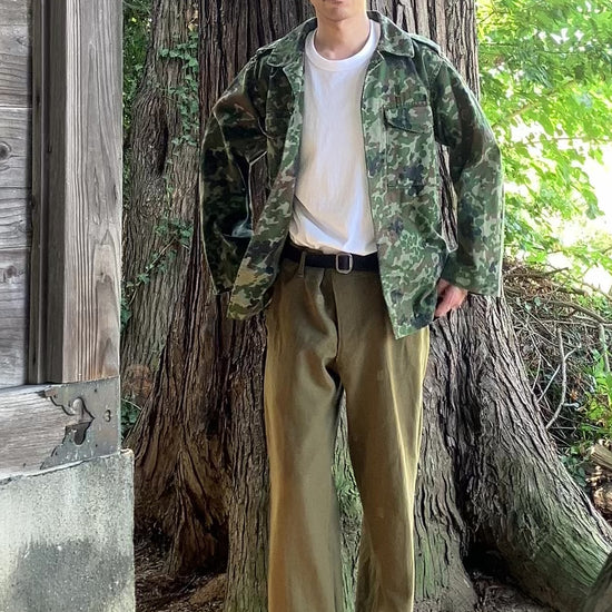 1990s JGSDF Type II camouflage jacket showcased with casual styling, including white T-shirt and Birkenstock Zurich sandals