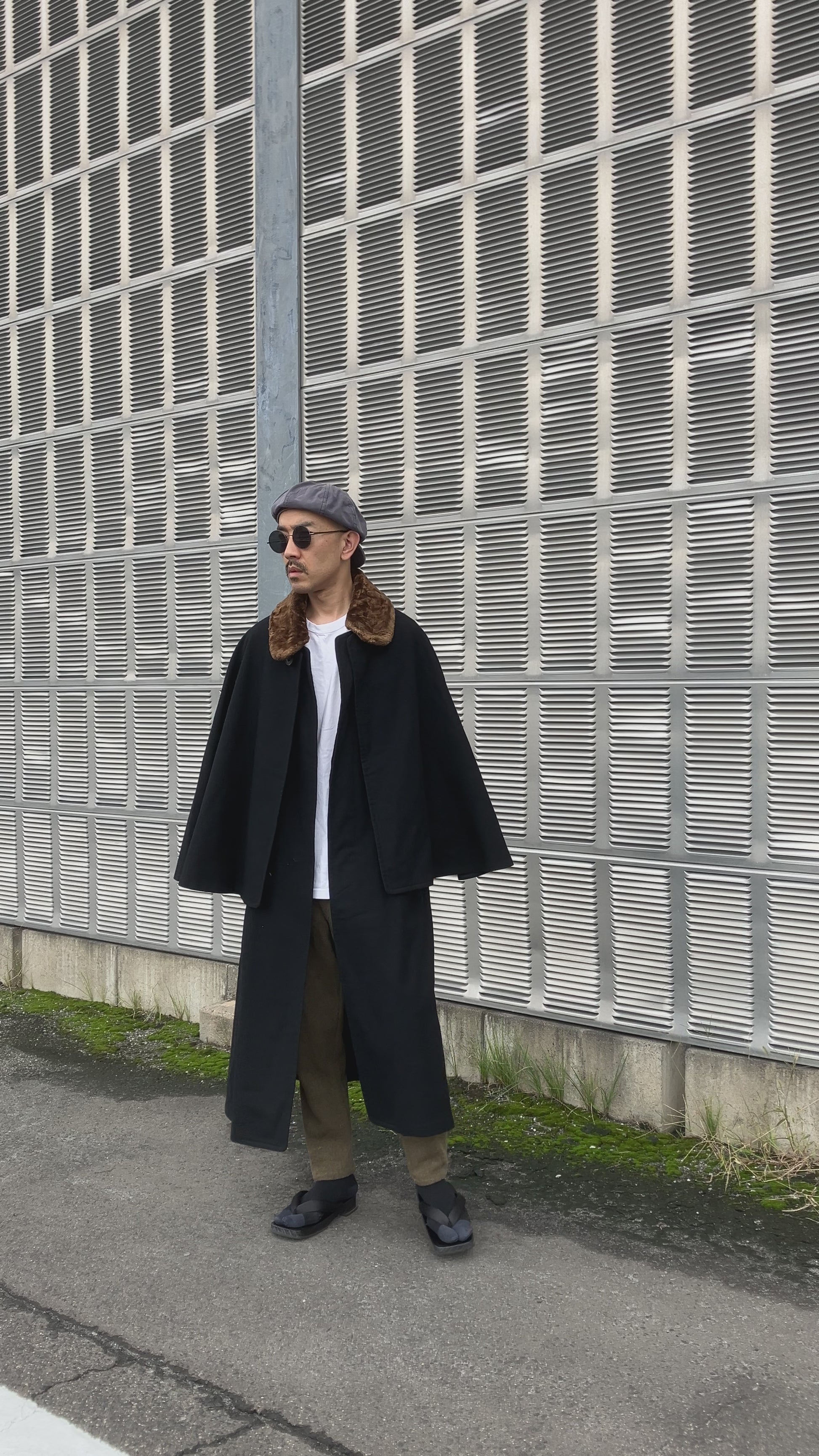 Model wearing 1920s Japanese Tonbi Mantle Inverness Coat, showing cape movement