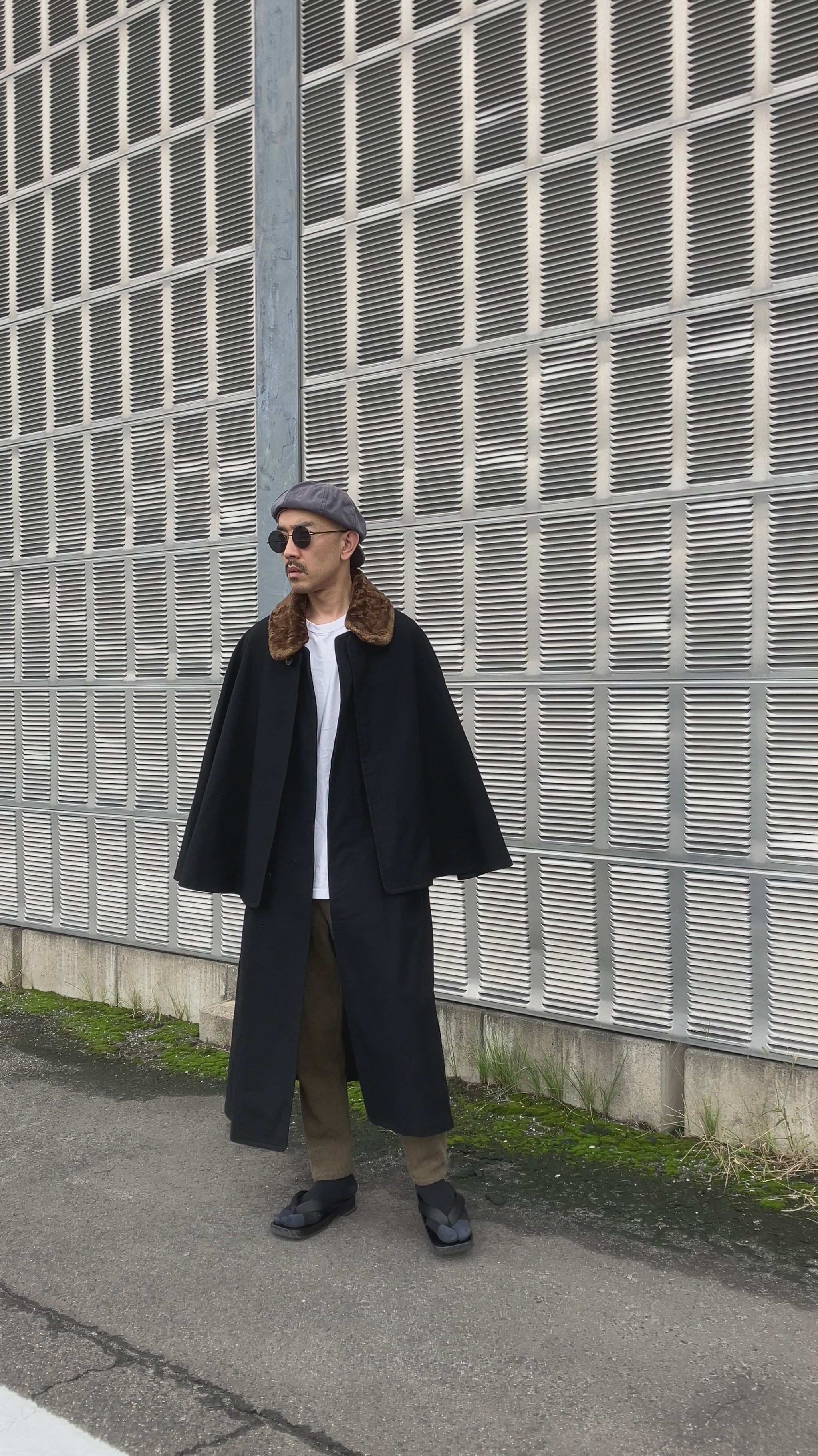 Model wearing 1920s Japanese Tonbi Mantle Inverness Coat, showing cape movement