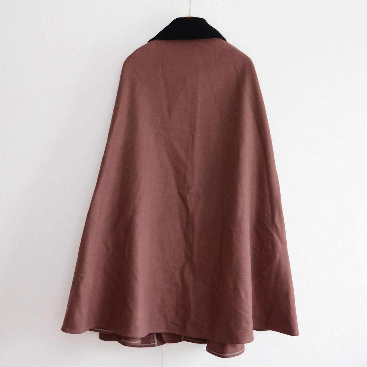 Wool mantle outerwear from mid-Showa Japan, emphasizing form and balance.