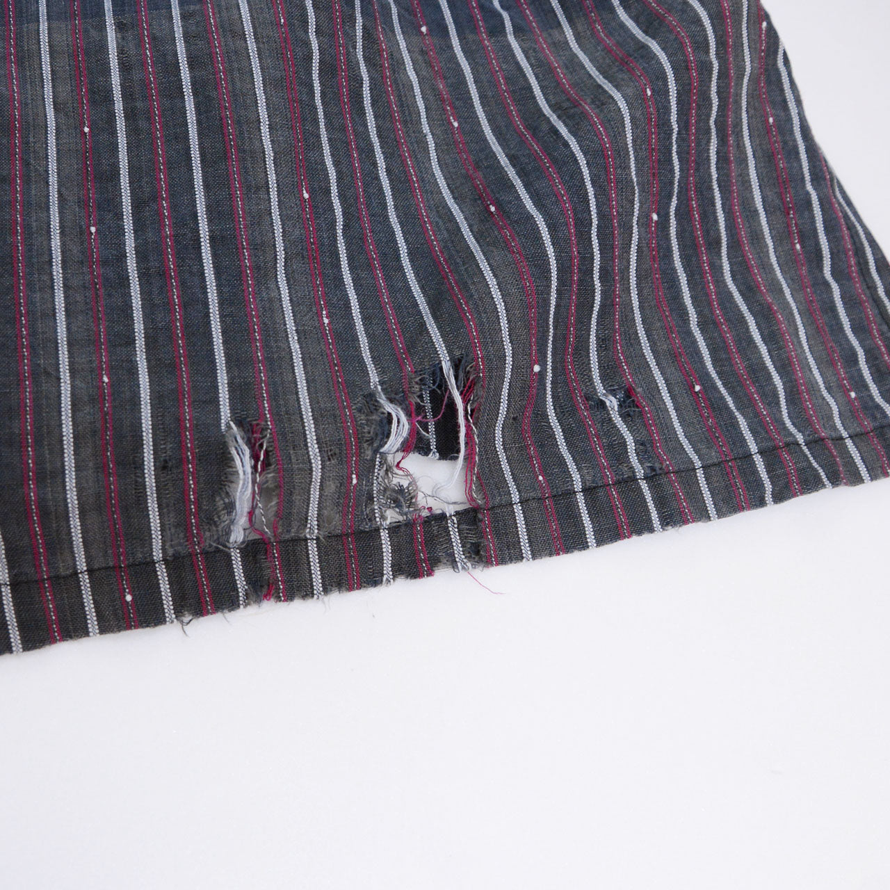 Torn and frayed hem detail on Showa-era stripe cotton tunic, vintage Japanese antique fabric condition
