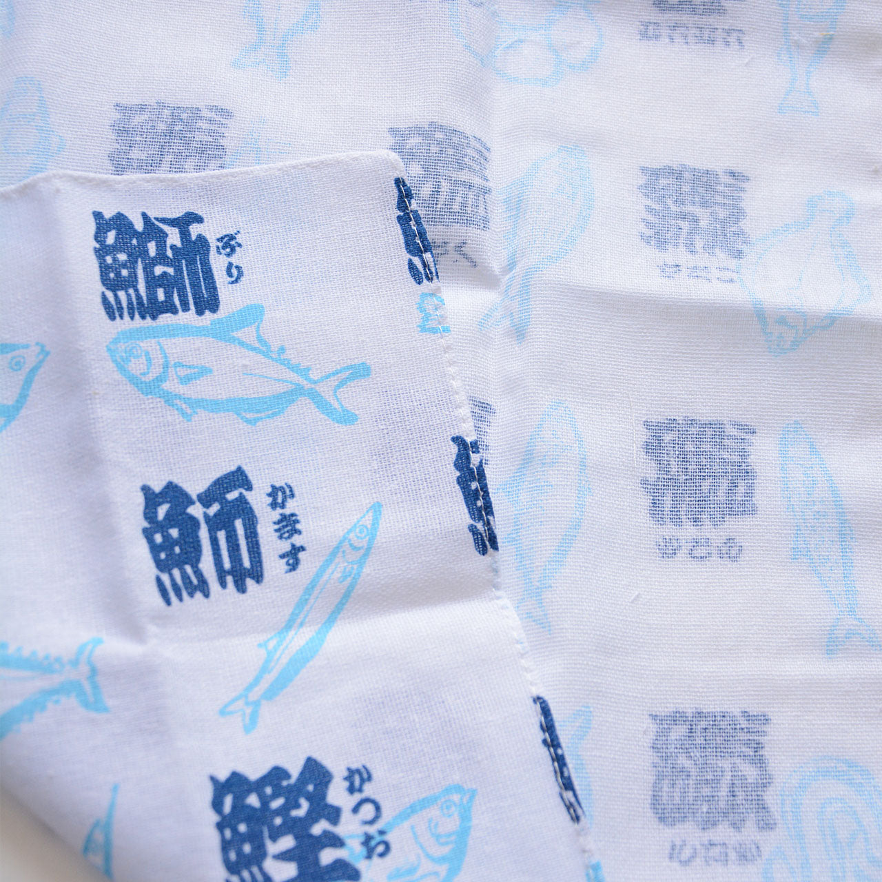 100% cotton tenugui with calligraphy-inspired fish motif