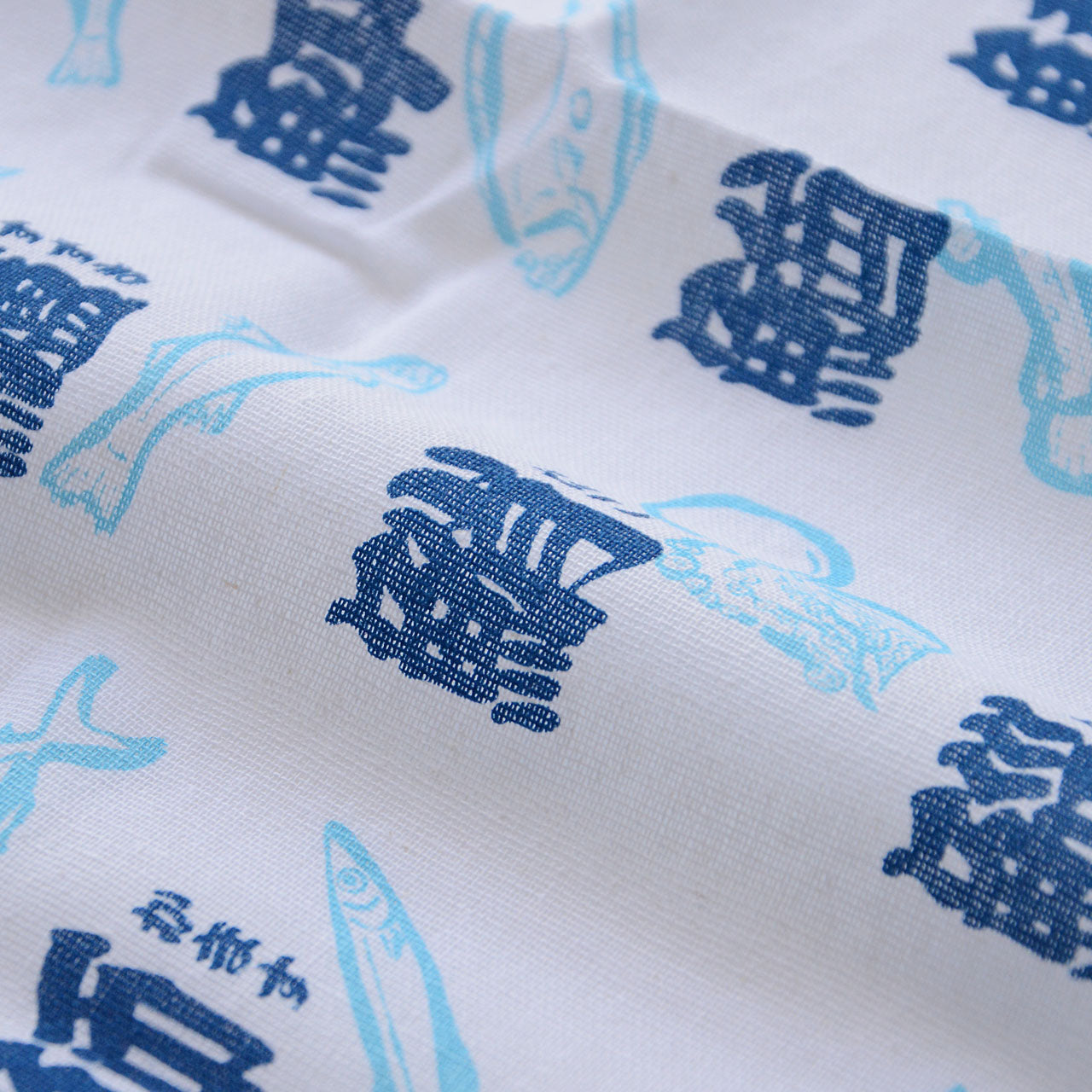 Decorative Japanese tenugui cloth with fish kanji design