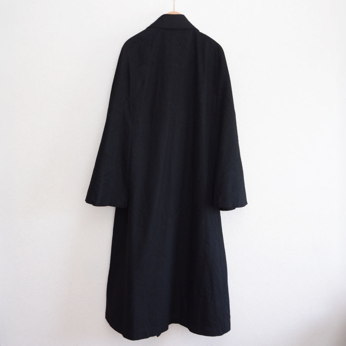 Matsuzakaya black wool tonbi coat with a broad cape over a long body, early Showa Japanese vintage