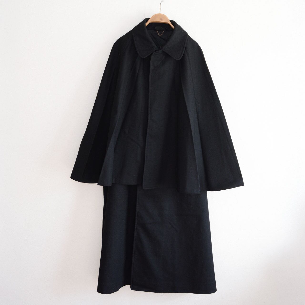 Black wool tonbi mantle coat, front view on hanger, double-cape Inverness silhouette, Taisho–Early Showa Japan vintage