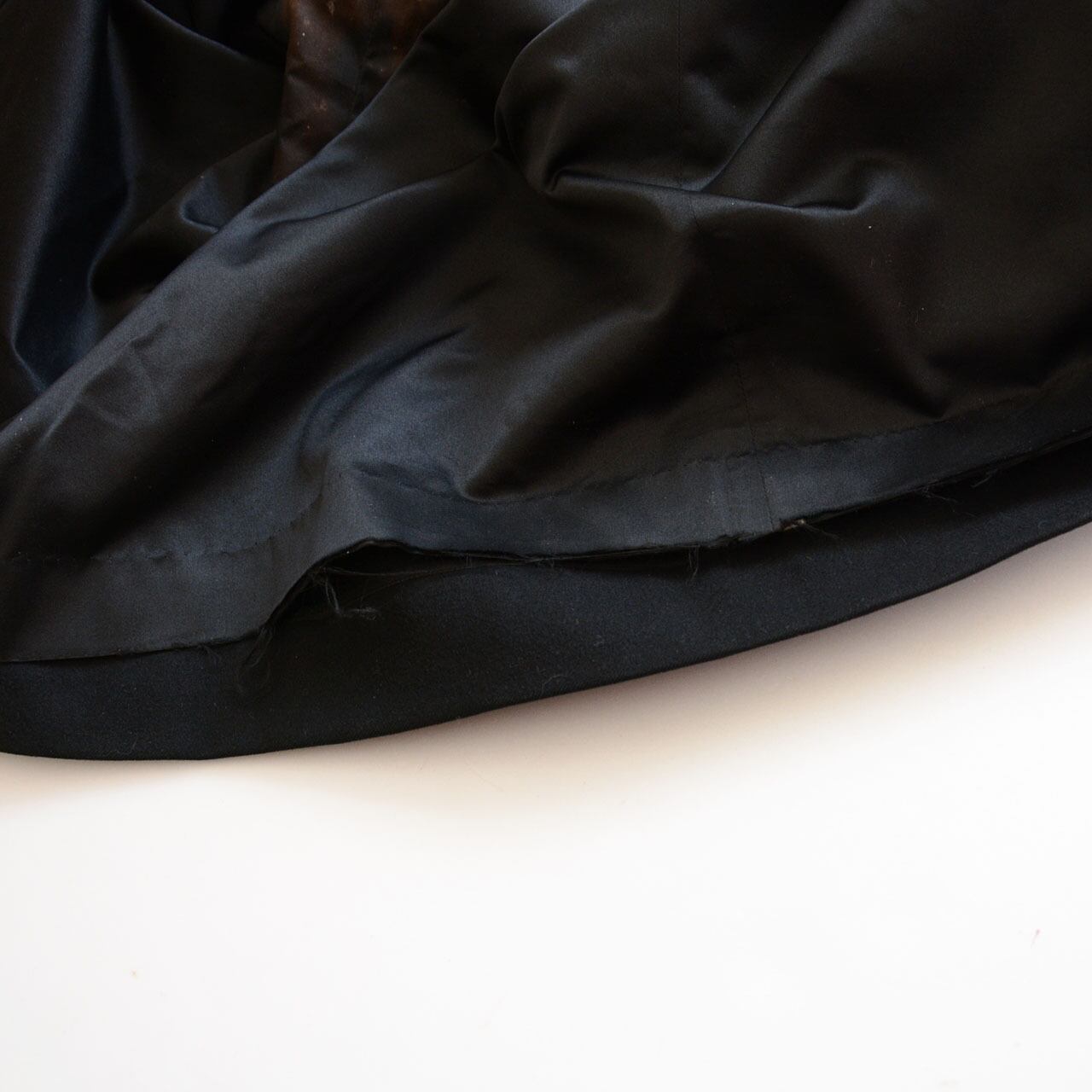 Hem of interior lining, black wool tonbi mantle, Taisho–Early Showa Japan vintage