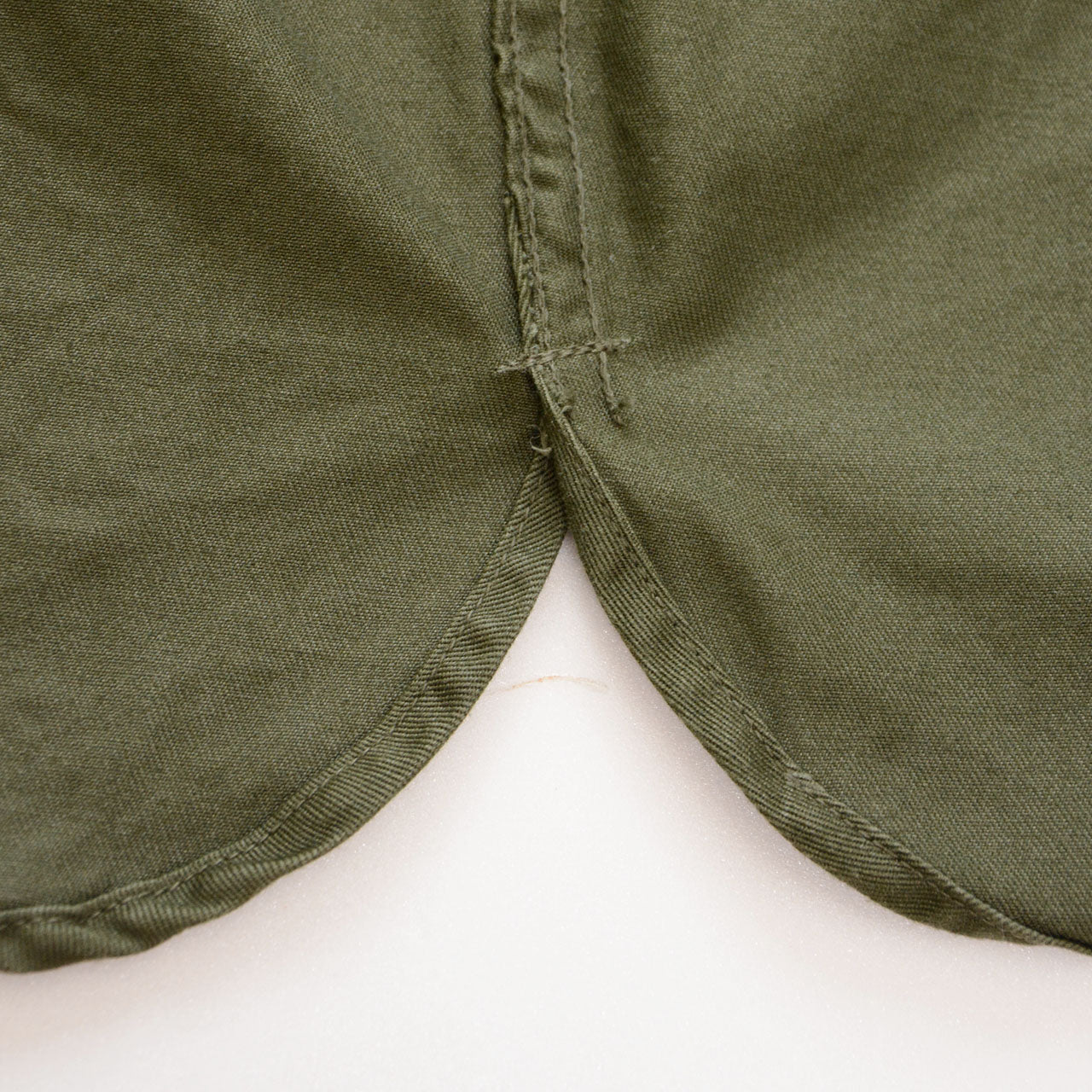Curved hem side detail, JGSDF Type 65 work jacket, olive drab cotton-vinylon