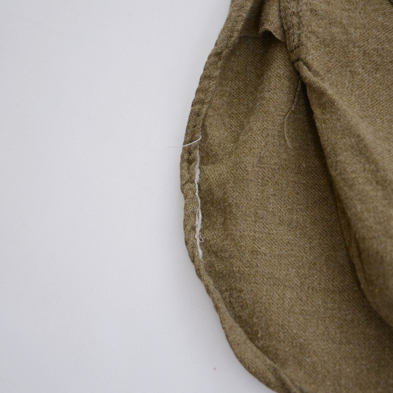 Close-up of stencil on 1940s military wool shirt