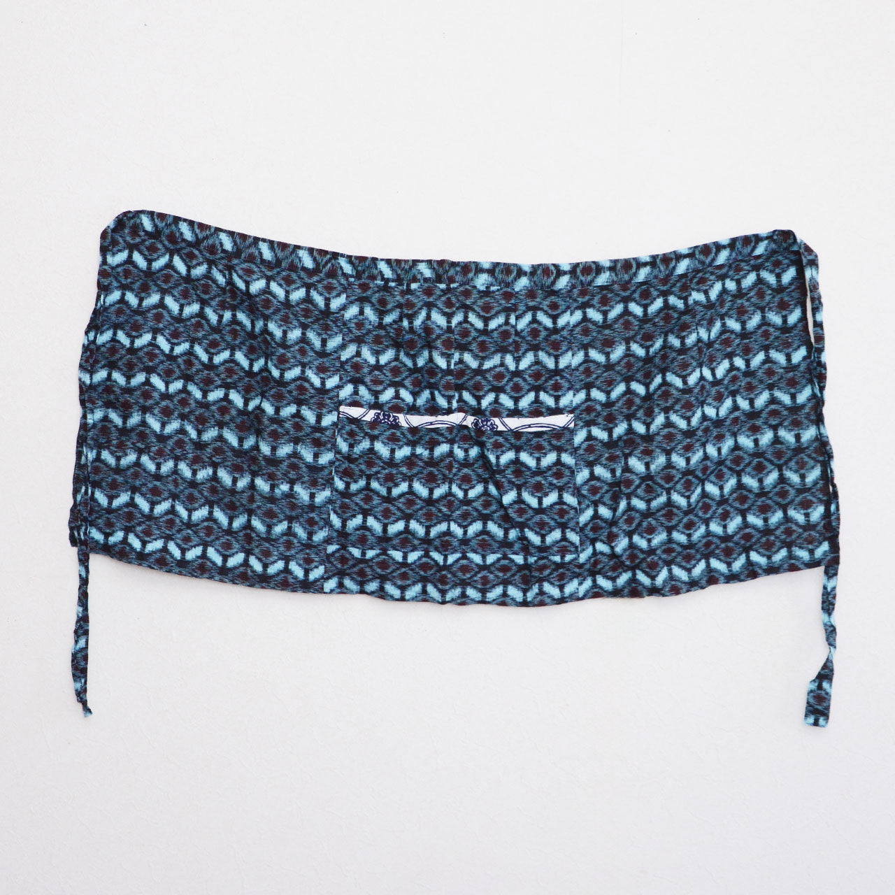 Indigo kasuri apron highlighting vintage Japanese textile patterns