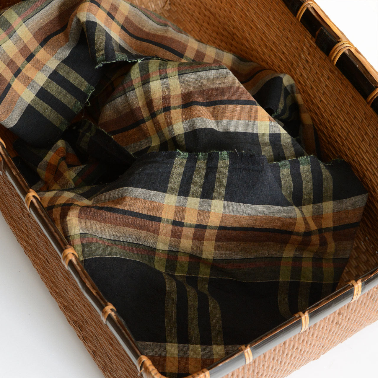 Vintage Japanese Boro fabric in black-check cotton, showing hand-stitched repairs.