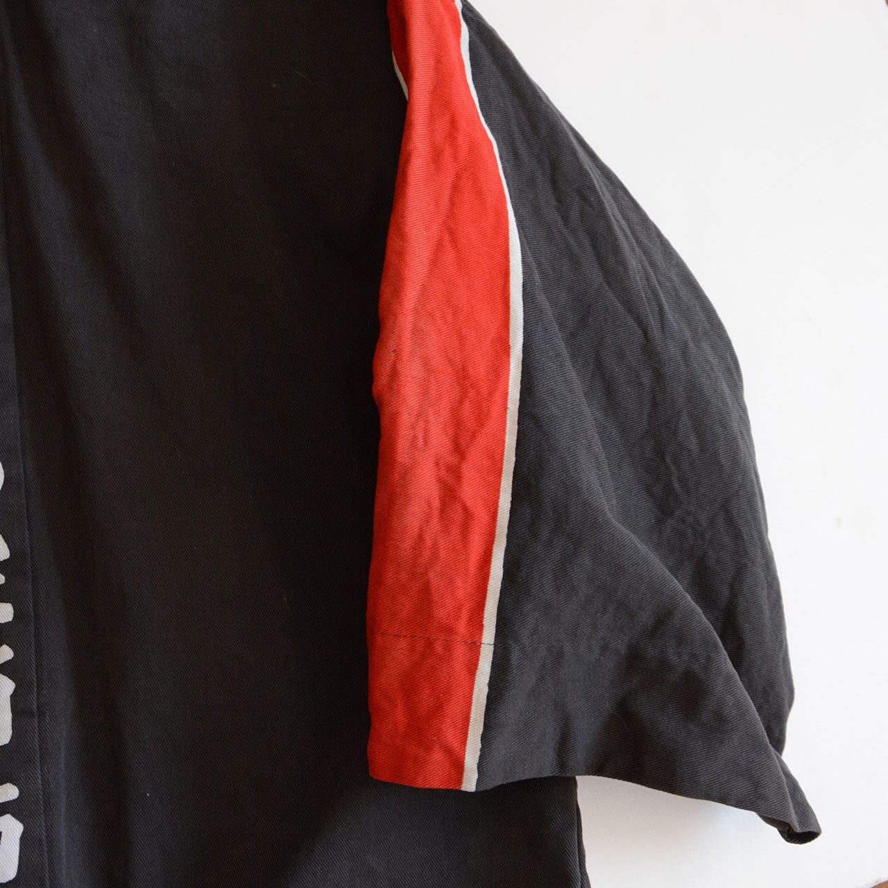 Faded gray cotton jacket with single kanji on the back