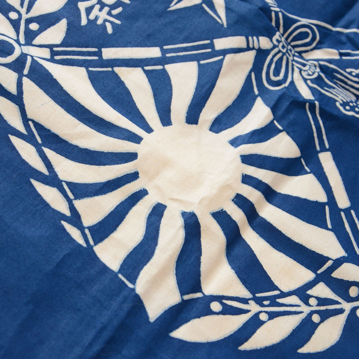 Blue cotton furoshiki with an ivory Rising Sun flag and laurel wreath design
