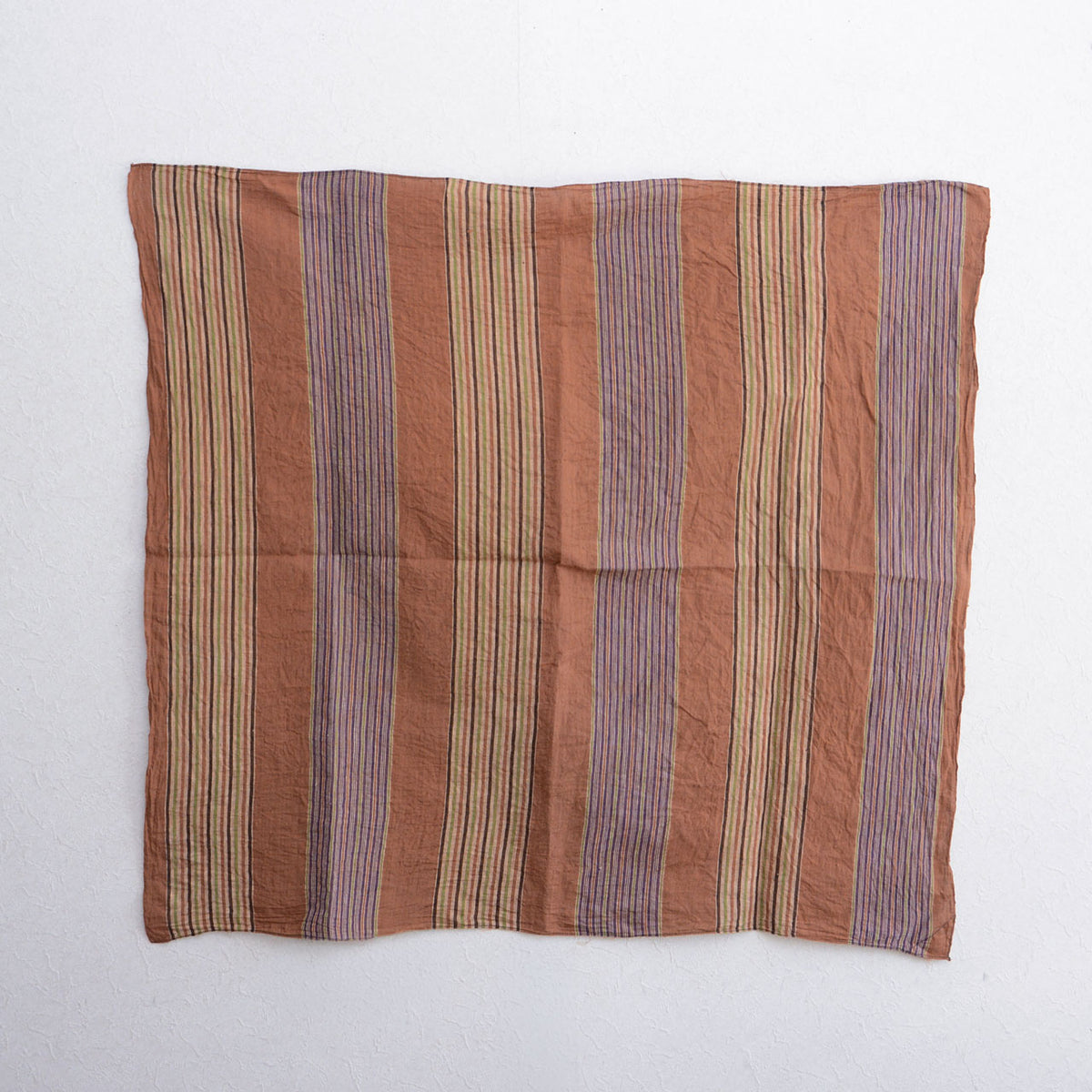 Vintage Japanese cotton furoshiki with alternating purple and cream striped bands on a rust ground