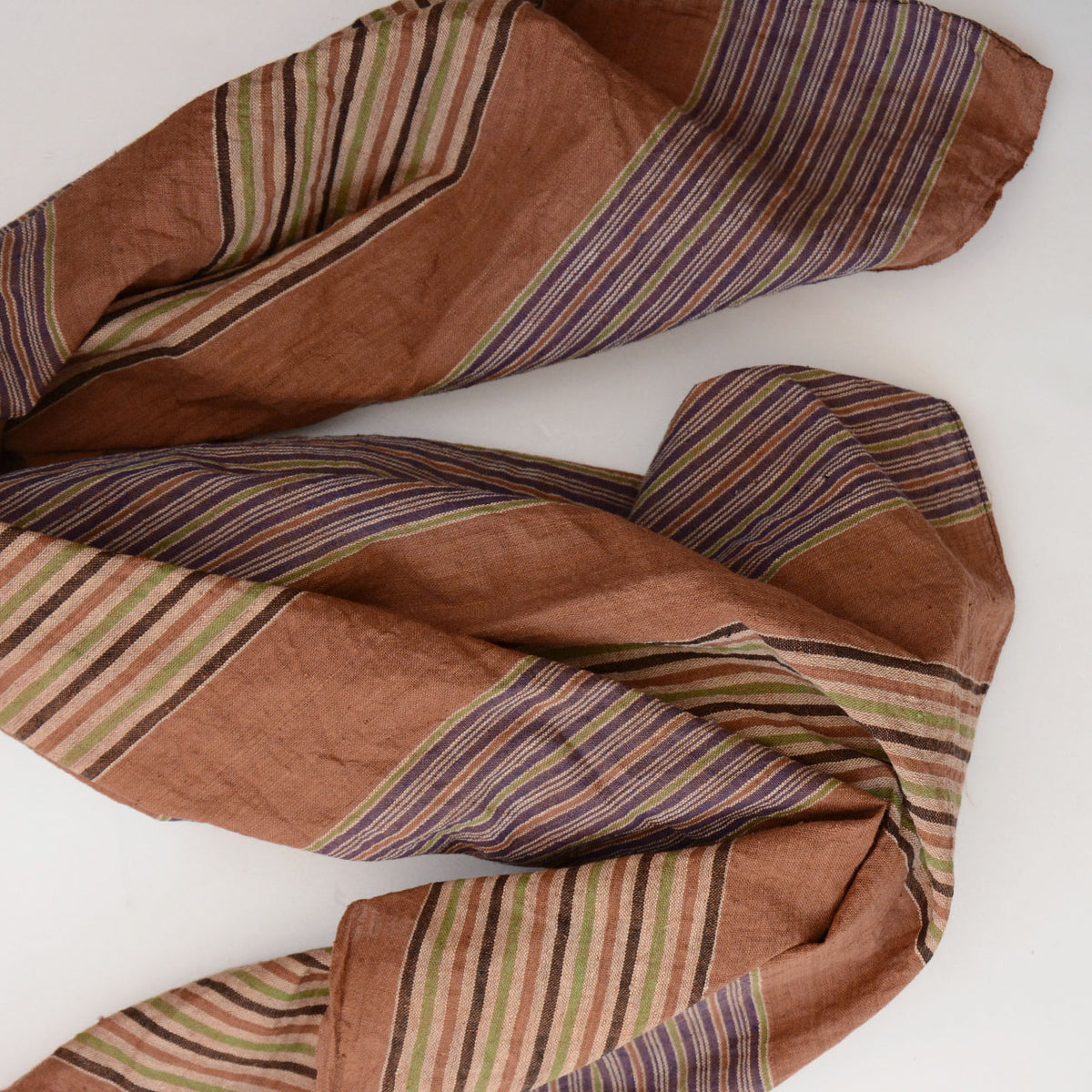 Mid-Showa striped cotton furoshiki in warm rust, muted purple, cream and pale green