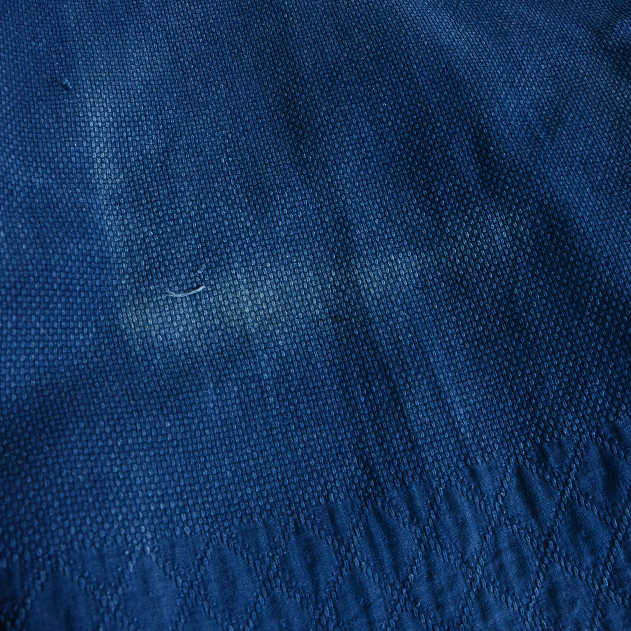 Indigo-dyed Japanese martial arts jacket with layered construction
