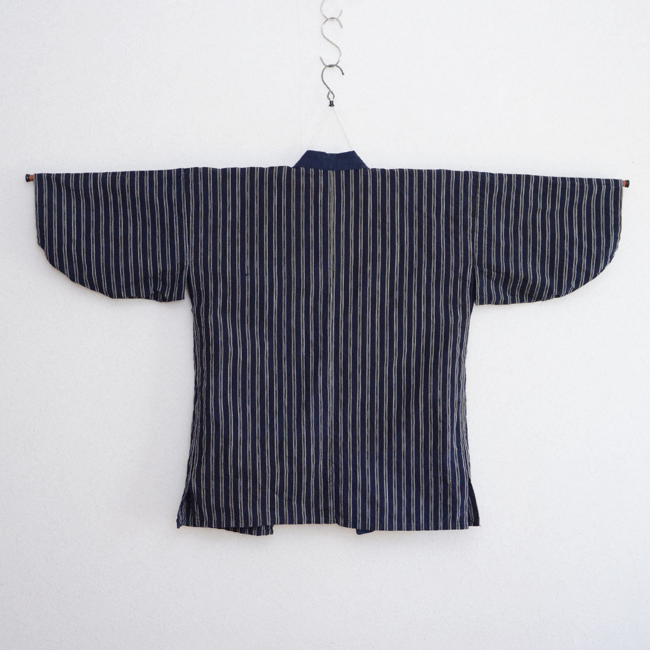 Traditional Japanese noragi featuring an indigo-dyed collar and striped fabric.