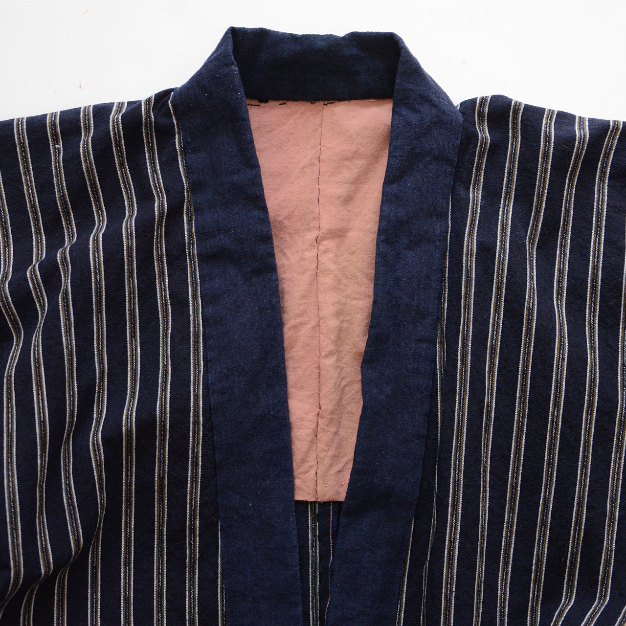 Japanese indigo work jacket blending heritage and modern style.