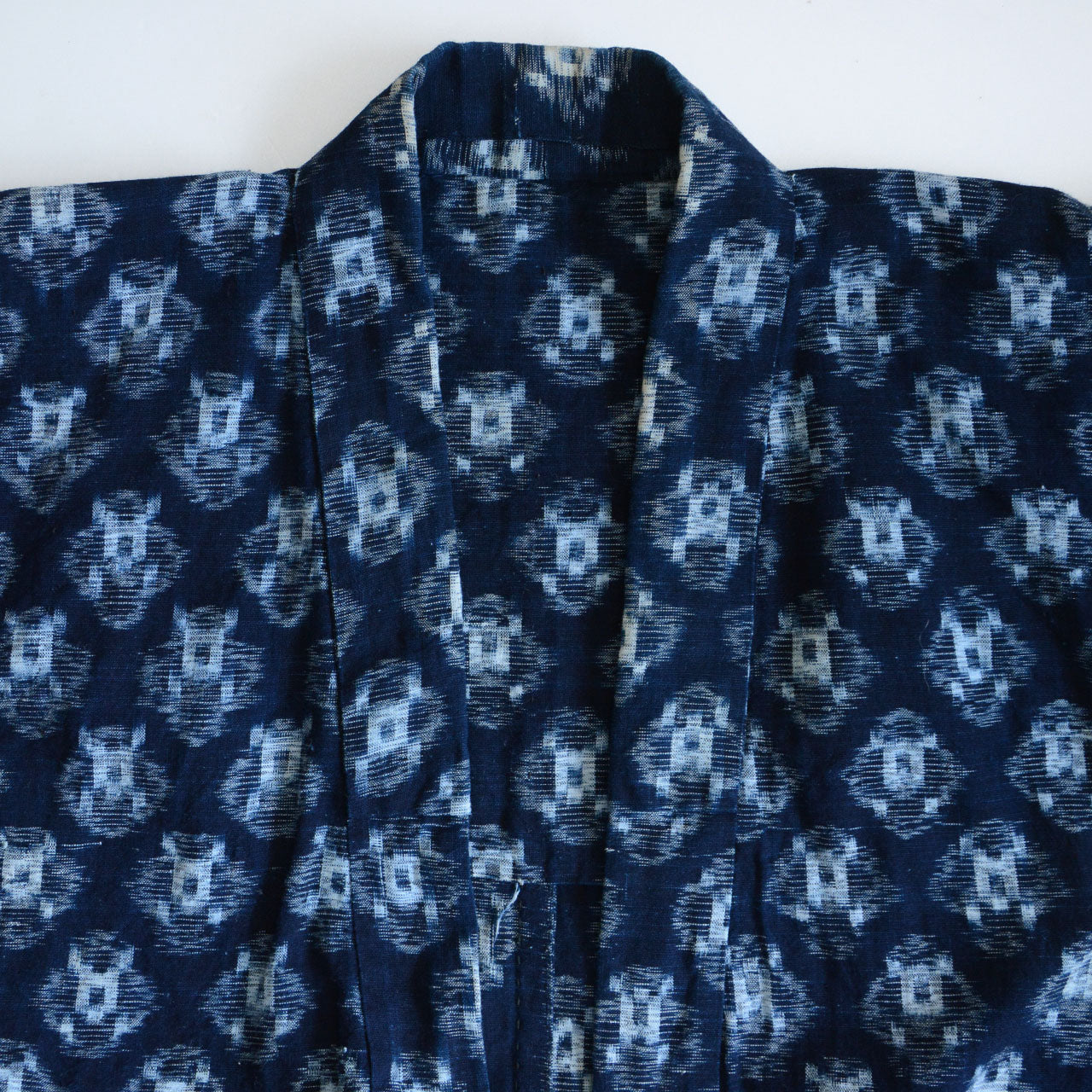 Japanese indigo-dyed workwear garment with a timeworn look