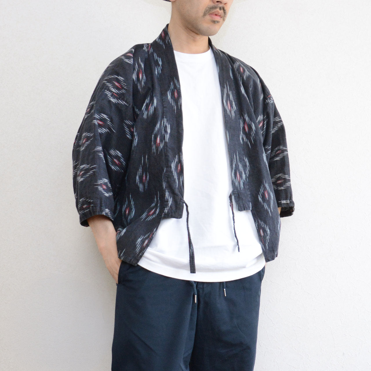 Black cotton noragi jacket with kasuri ikat pattern, faded patina, mid-Showa era Japan vintage