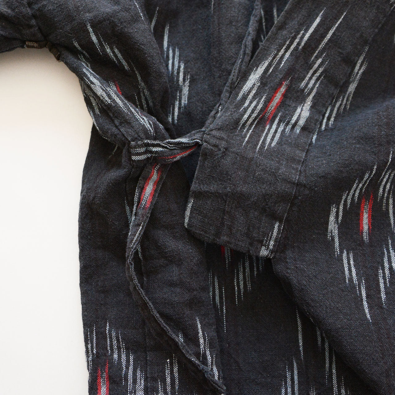 Rare black-ground noragi in aged cotton with kasuri ikat motifs, mid-Showa Japan vintage