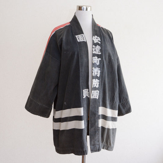 Vintage Japanese fire brigade hanten in faded charcoal cotton – Mid-20th century