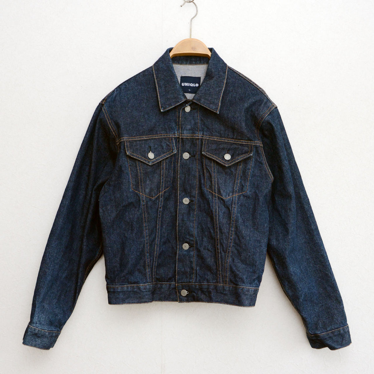 Late 1990s–early 2000s UNIQLO dark indigo denim jacket with brown stitching